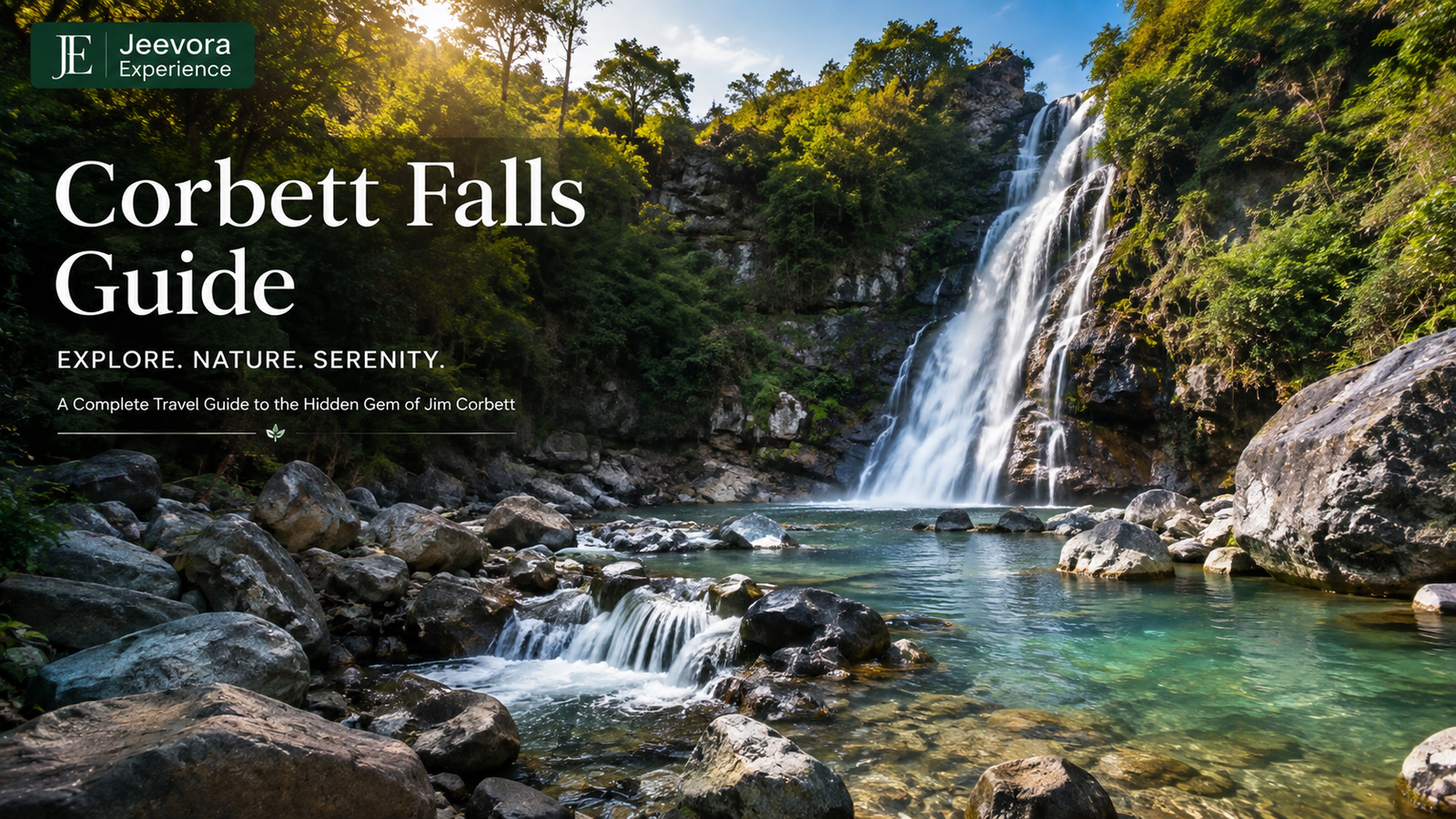 Corbett Falls cascading through a lush green forest near Jim Corbett National Park in Uttarakhand.